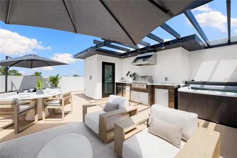 a kitchen with a table and chairs in it