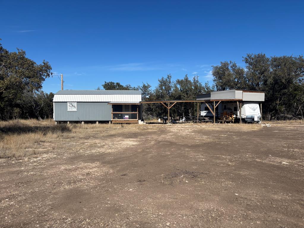 a view of house with a yard