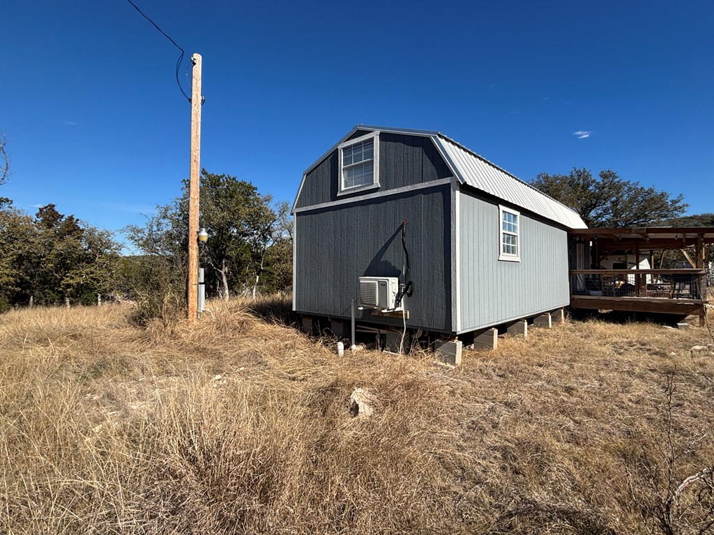 2043 Sd 45670 Rocksprings, TX 78880 - Photo 16 of 44 a backyard of a house with lots of green space