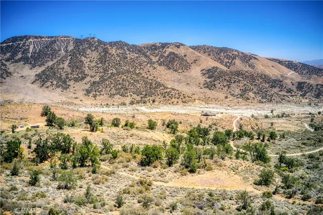 a view of mountain view with mountains in the background
