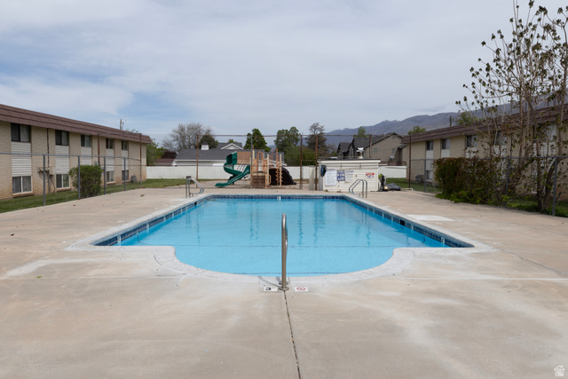 314 West Center Street, Unit A83 Bountiful, UT 84010 - Photo 19 of 19 Community pool featuring a patio and a residential view
