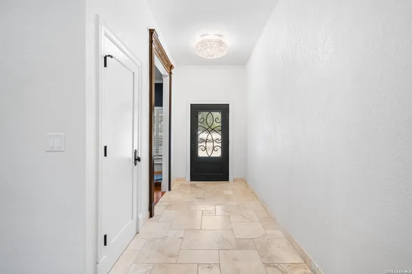 a bedroom with a bed window and a desk