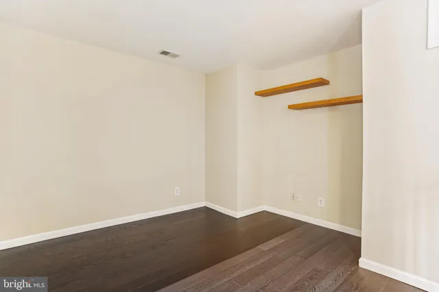 a view of a small space with wooden floor