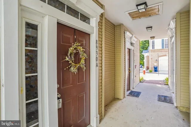 a view of a hallway with a outdoor space