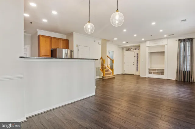a view of a livingroom with wooden floor