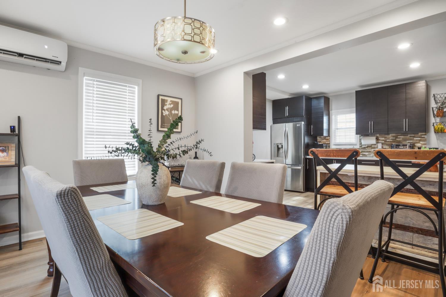 59 South 2nd Street Fords, NJ 08863 - Photo 11 of 37 a view of a dining room with furniture window and wooden floor