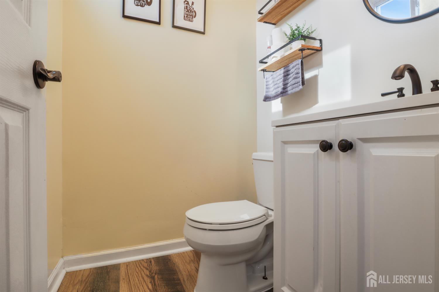 59 South 2nd Street Fords, NJ 08863 - Photo 14 of 37 a bathroom with a toilet and a sink