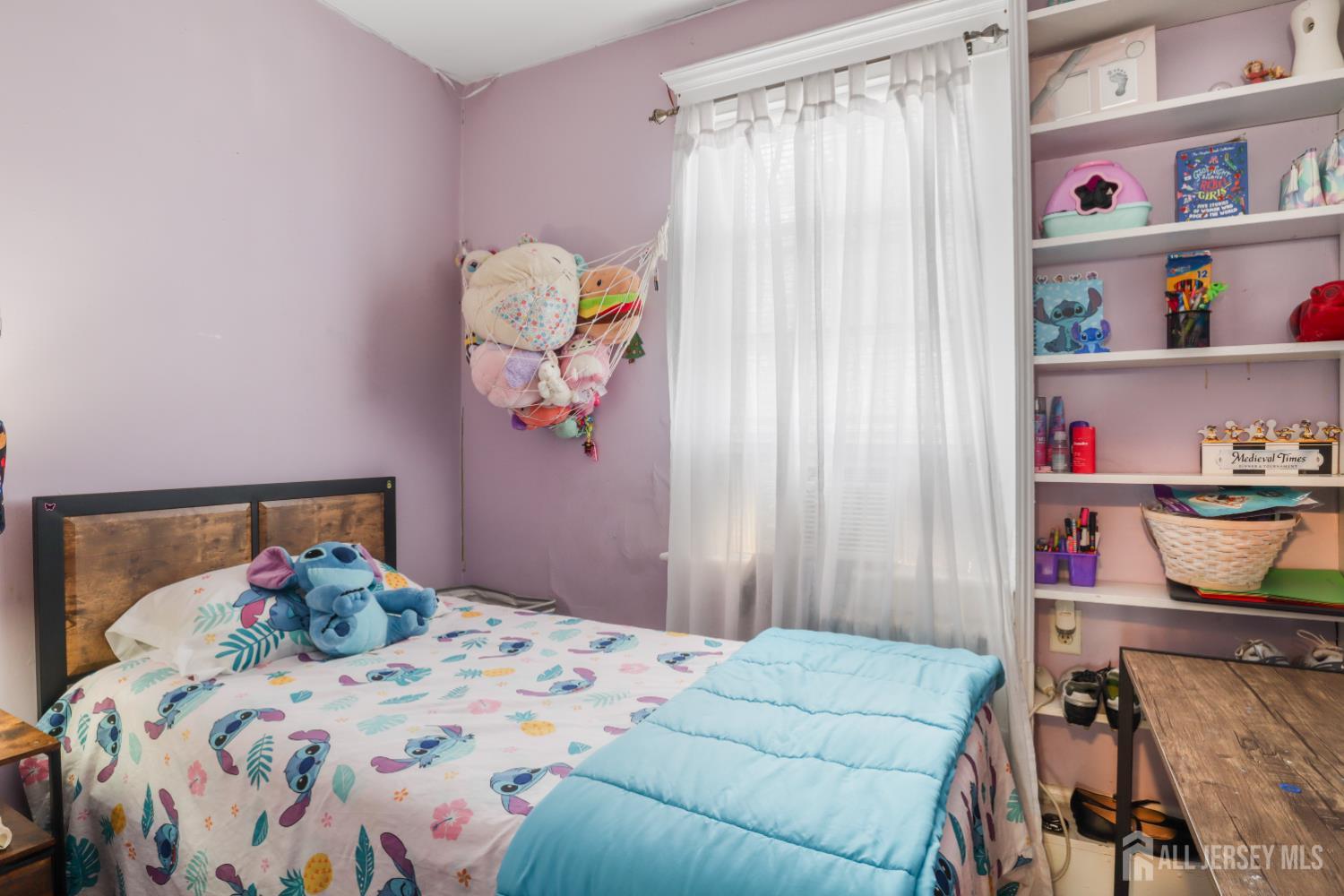 59 South 2nd Street Fords, NJ 08863 - Photo 18 of 37 a bedroom with a bed and a window