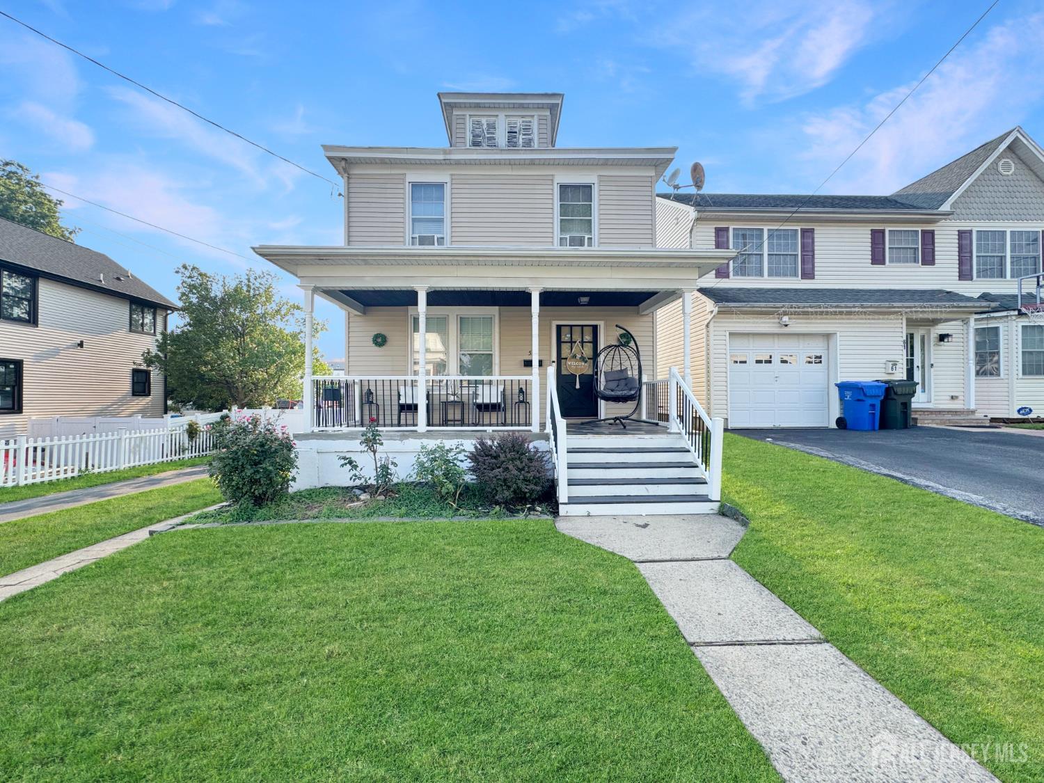 59 South 2nd Street Fords, NJ 08863 - Photo 2 of 37 a front view of a house with a yard