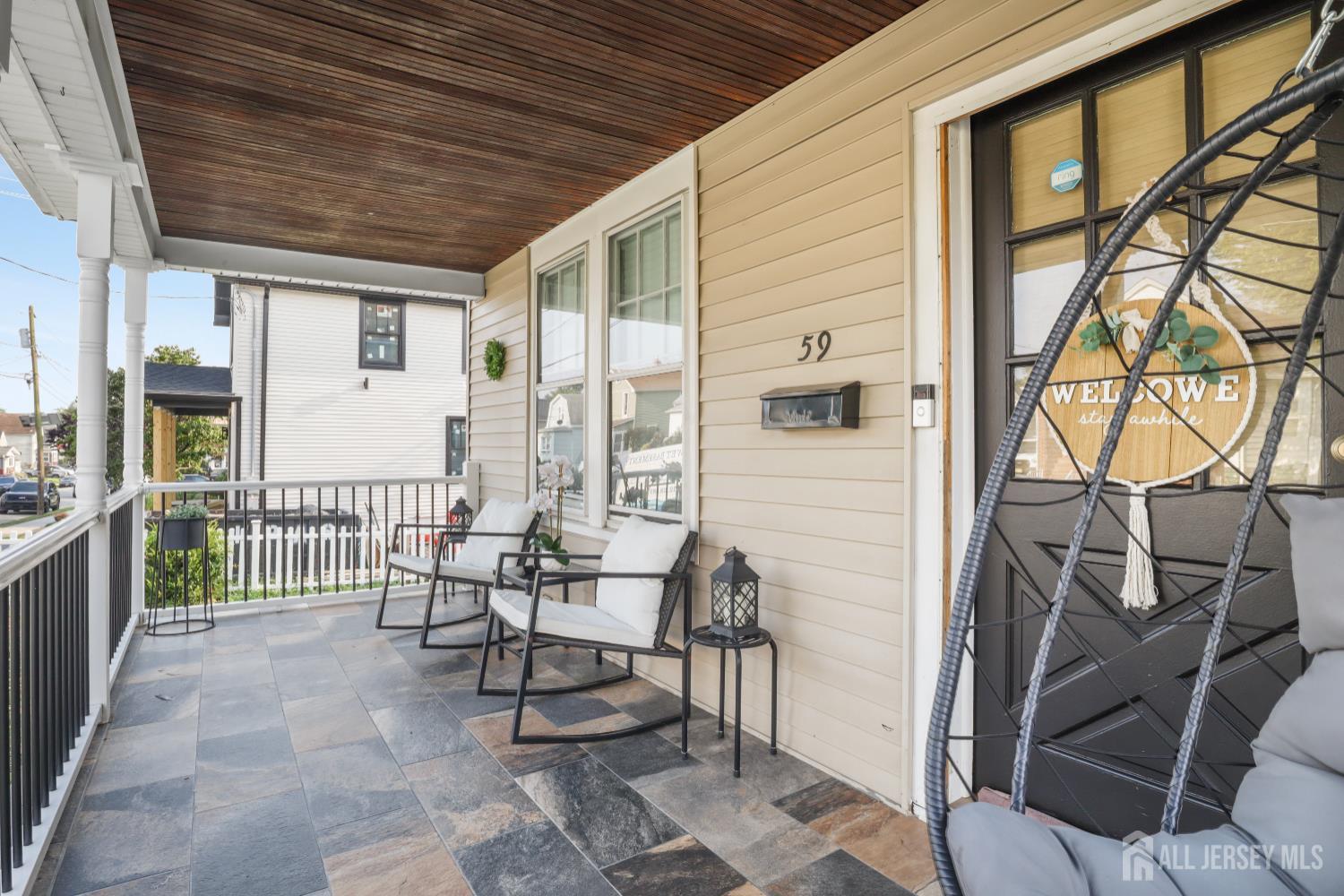 59 South 2nd Street Fords, NJ 08863 - Photo 6 of 37 a view of a patio with a table and chairs and wooden floor