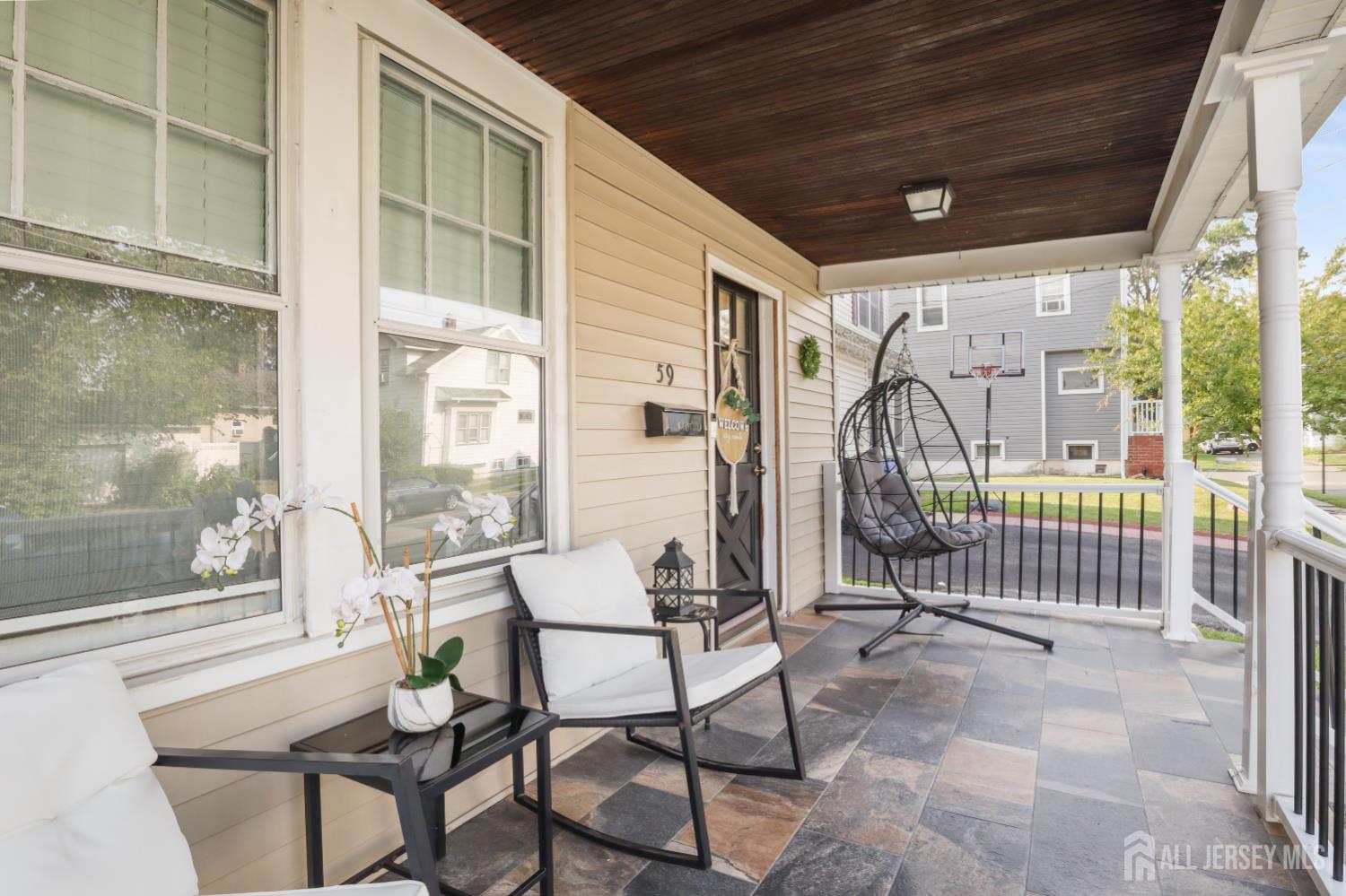 59 South 2nd Street Fords, NJ 08863 - Photo 7 of 37 a porch with a table and chairs