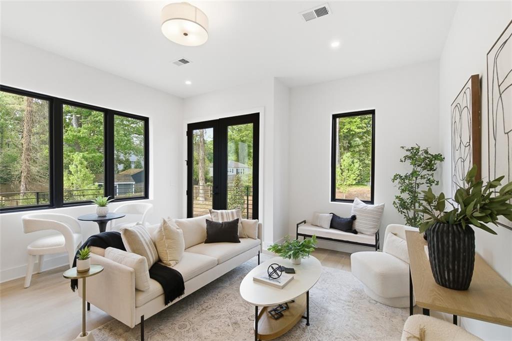 1194 Penny Lane Atlanta, GA 30329 - Photo 12 of 50 a living room with furniture potted plant floor and a window