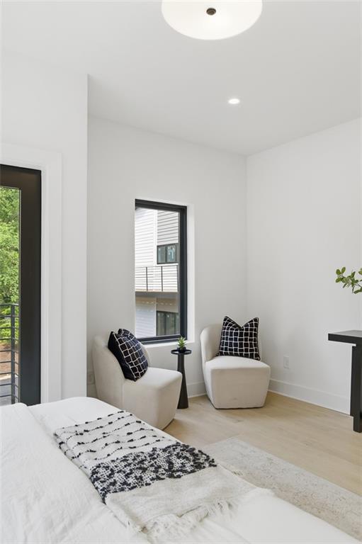 1194 Penny Lane Atlanta, GA 30329 - Photo 22 of 50 a bedroom with a bed and a couch
