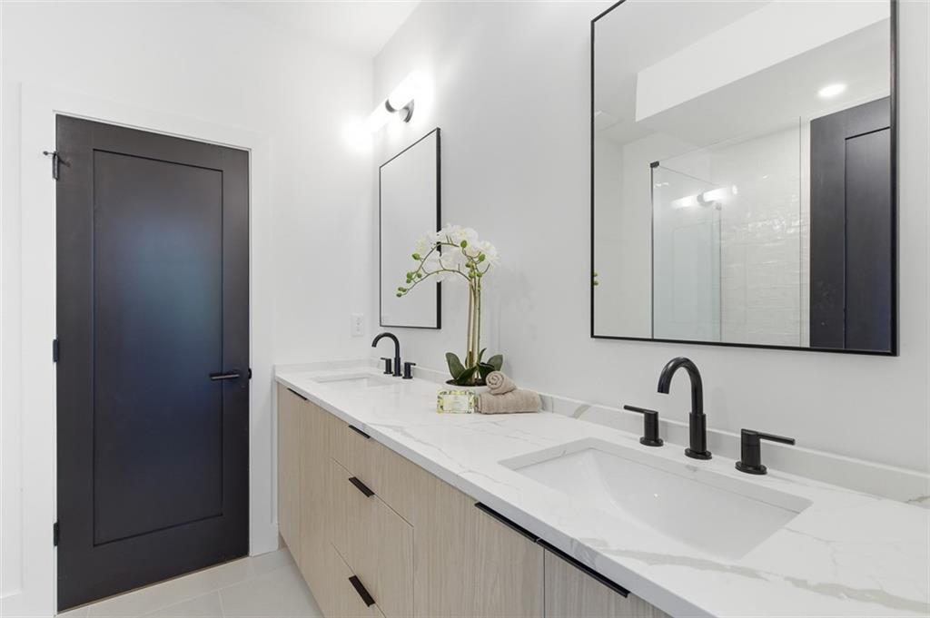1194 Penny Lane Atlanta, GA 30329 - Photo 26 of 50 a bathroom with a sink and a mirror