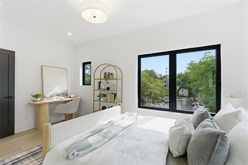 1194 Penny Lane Atlanta, GA 30329 - Photo 27 of 50 a bedroom with a bed and a large window