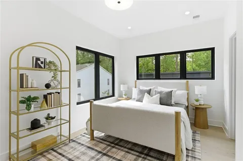 a bedroom with bed and a window