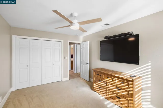 a bathroom with a toilet a sink and a mirror