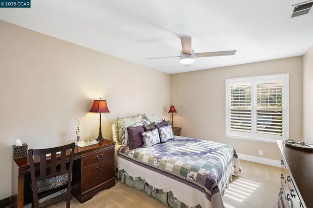 a view of living room with furniture and large window