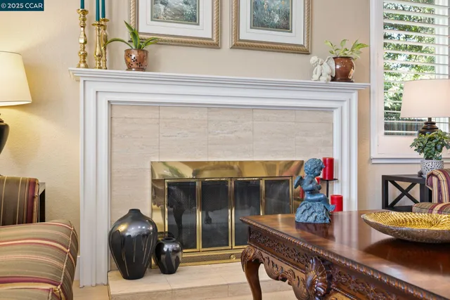 a bedroom with furniture and a fireplace