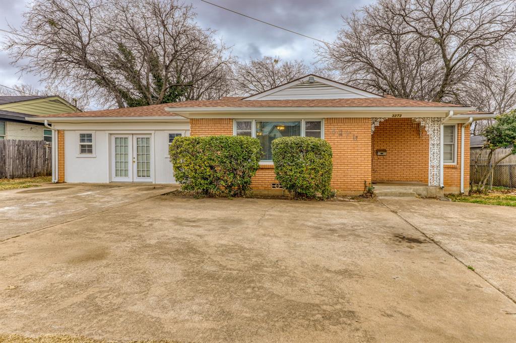 front view of a house with a garden