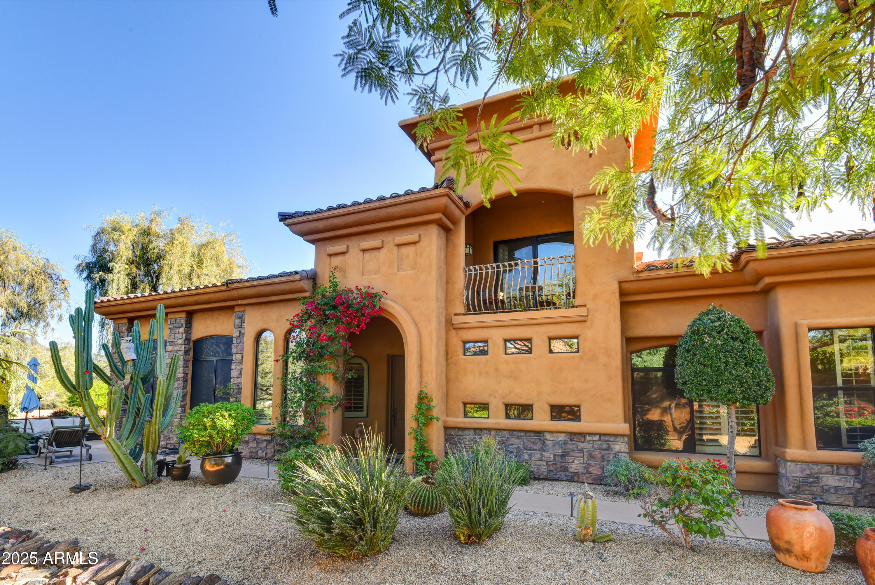 front view of a house with potted plants
