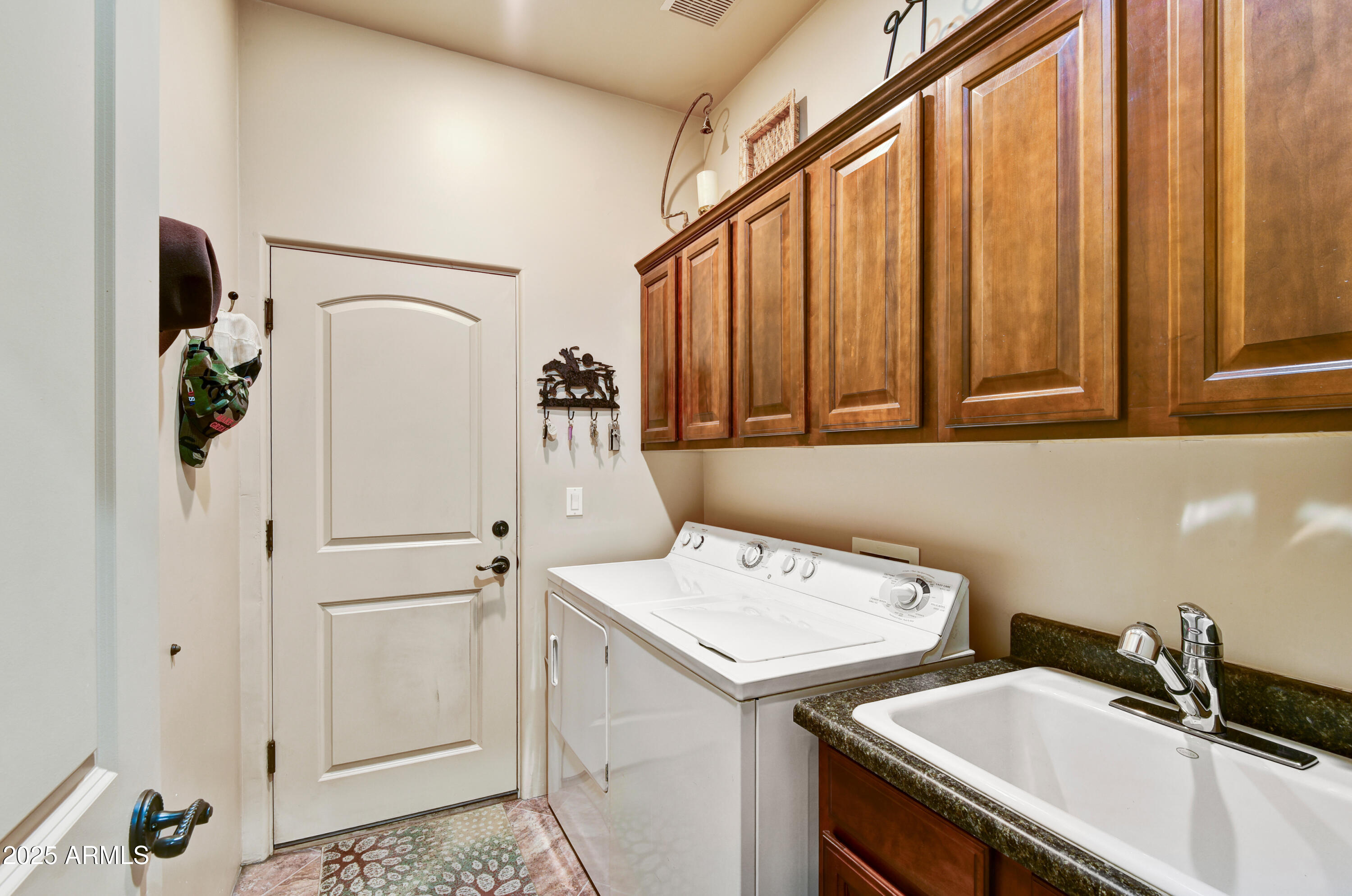 7199 East Ridgeview Place, Unit 100 Carefree, AZ 85377 - Photo 14 of 25 a utility room with dryer and washer