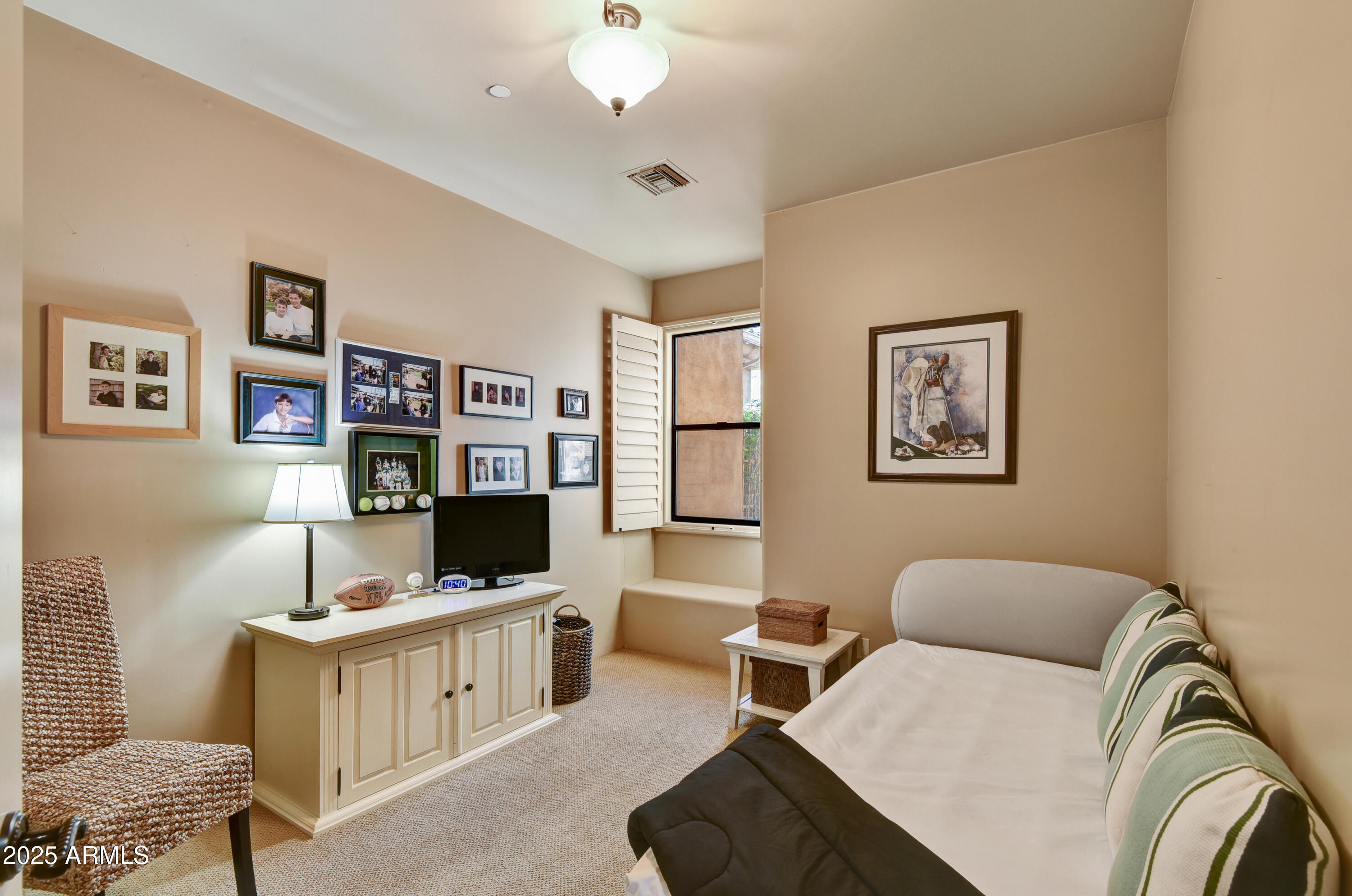 7199 East Ridgeview Place, Unit 100 Carefree, AZ 85377 - Photo 15 of 25 a living room with furniture and a flat screen tv