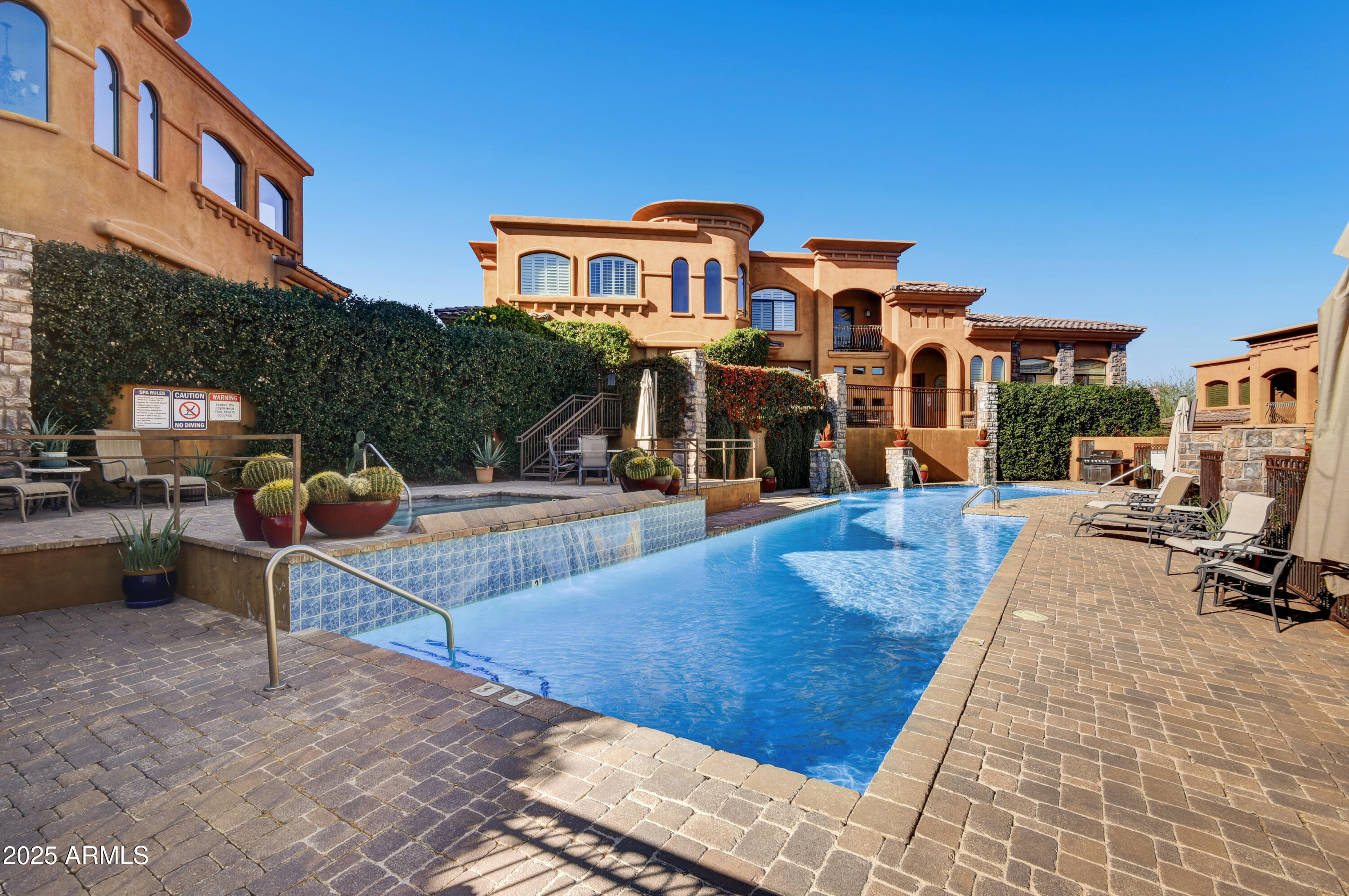 7199 East Ridgeview Place, Unit 100 Carefree, AZ 85377 - Photo 22 of 25 a view of a building with many windows