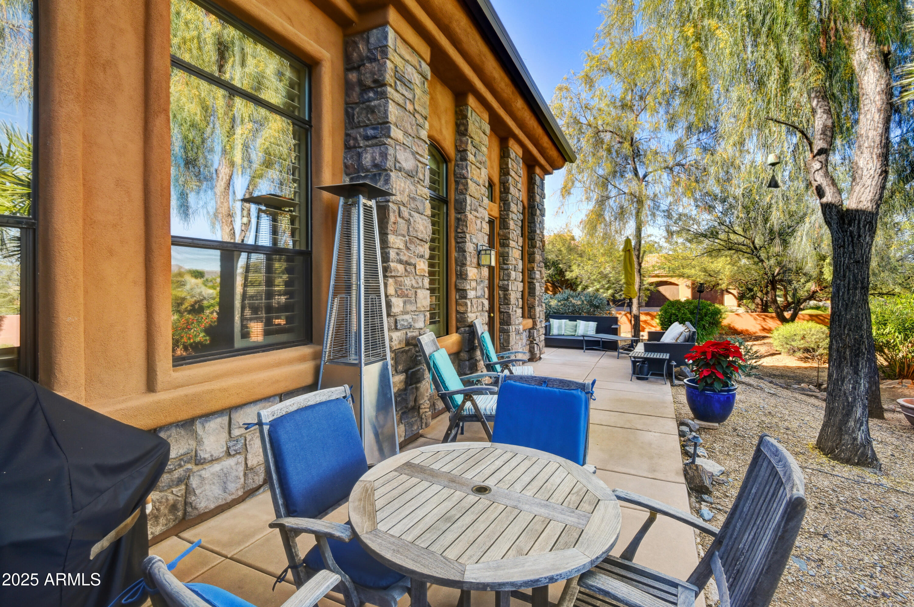 7199 East Ridgeview Place, Unit 100 Carefree, AZ 85377 - Photo 23 of 25 a view of a dining room with furniture window and wooden floor