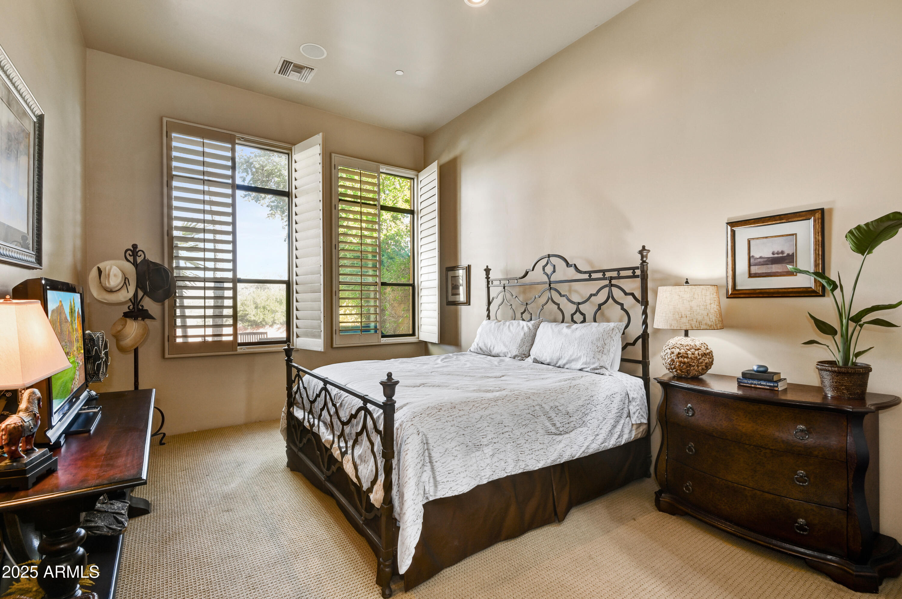 7199 East Ridgeview Place, Unit 100 Carefree, AZ 85377 - Photo 7 of 25 a bedroom with a bed and a dresser