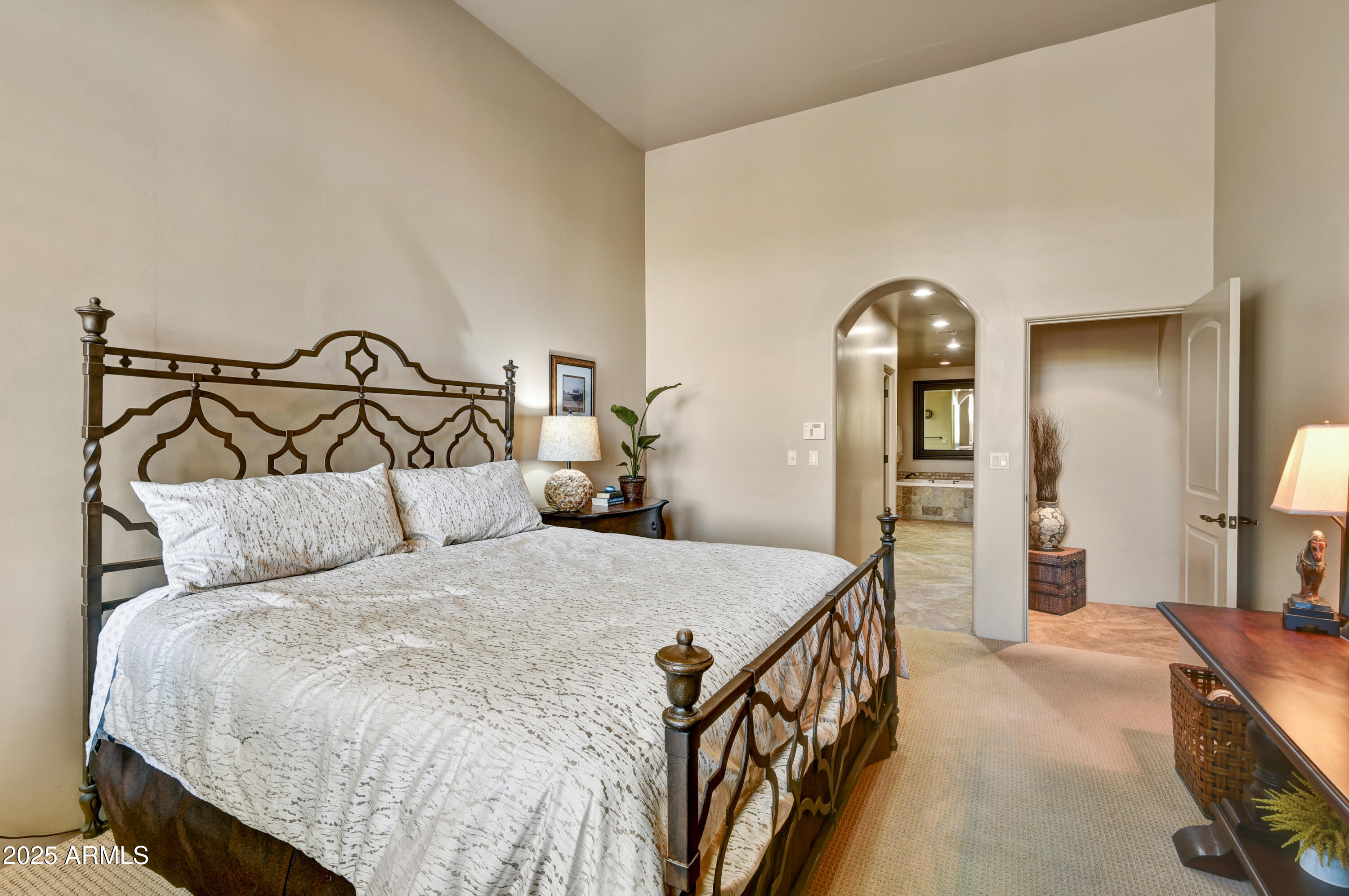 7199 East Ridgeview Place, Unit 100 Carefree, AZ 85377 - Photo 8 of 25 a bedroom with a bed and a dresser