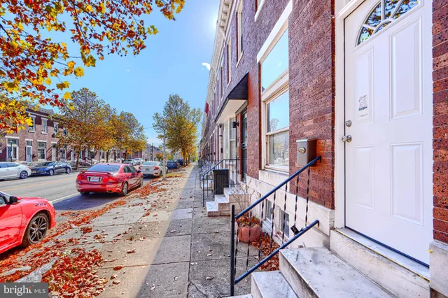 a view of car parked in front of brick building