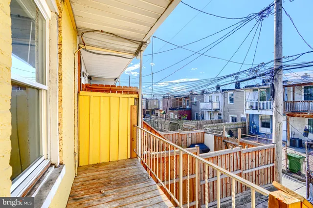 a view of balcony with furniture