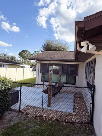a view of a backyard with sitting area