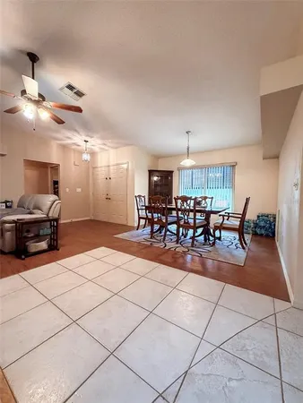 a living room with lots of chairs and a table