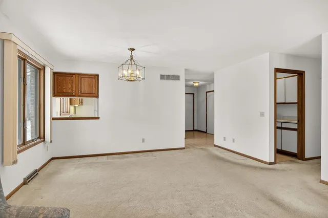 an empty room with closet area