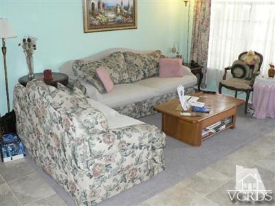 2941 Isle Way, Unit C Oxnard, CA 93035 - Photo 3 of 3 a living room with furniture and a couch