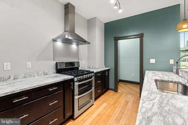 a kitchen with a stove and a sink