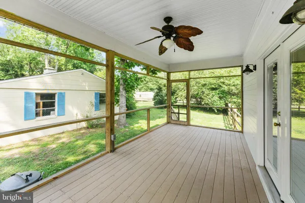 a view of porch with a floor to ceiling window