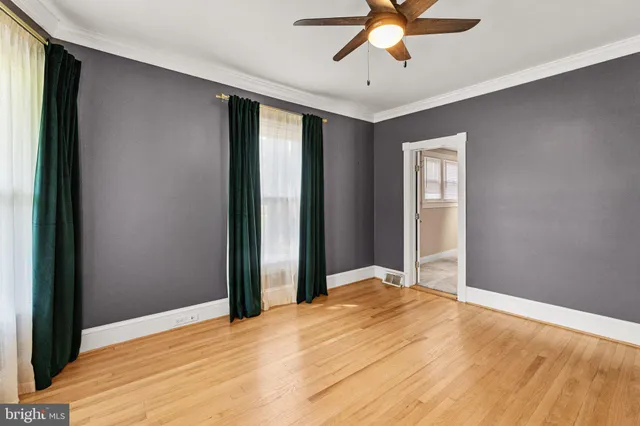 a view of a livingroom with a chandelier fan