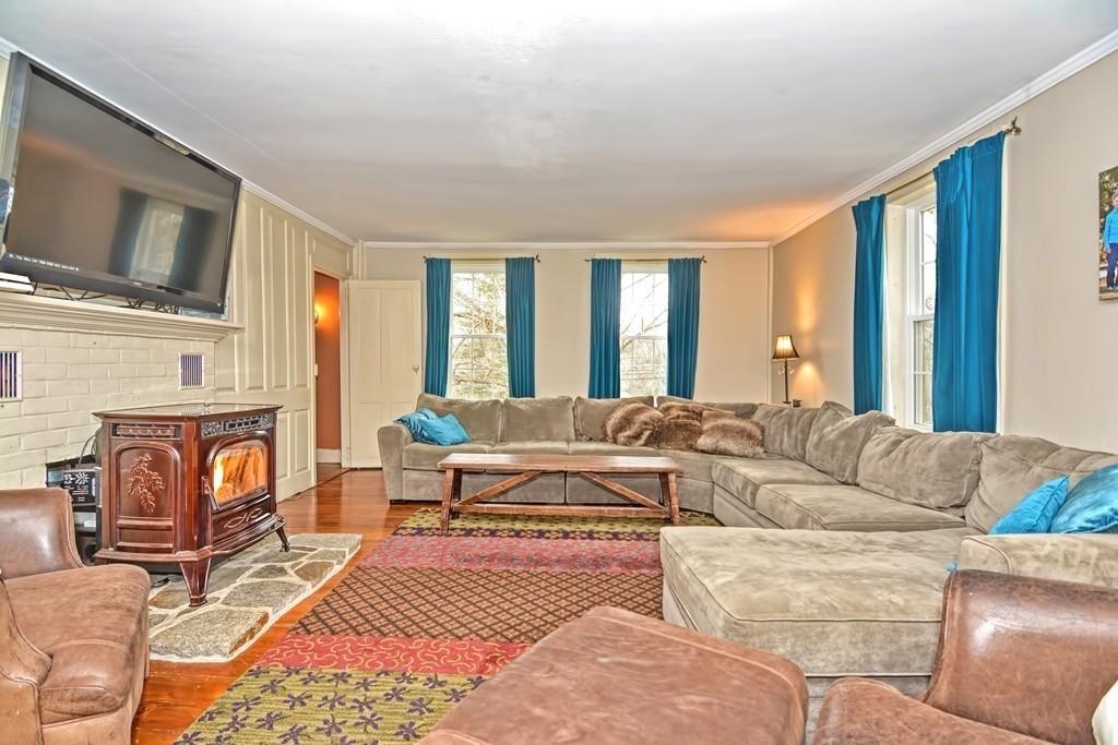 50 Warren Road Brimfield, MA 01010 - Photo 16 of 42 a living room with furniture fireplace and flat screen tv