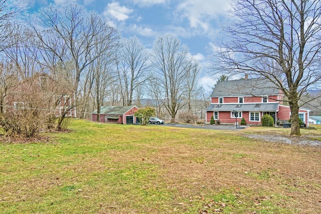 50 Warren Road Brimfield, MA 01010 - Photo 2 of 42 a front view of a house with a yard