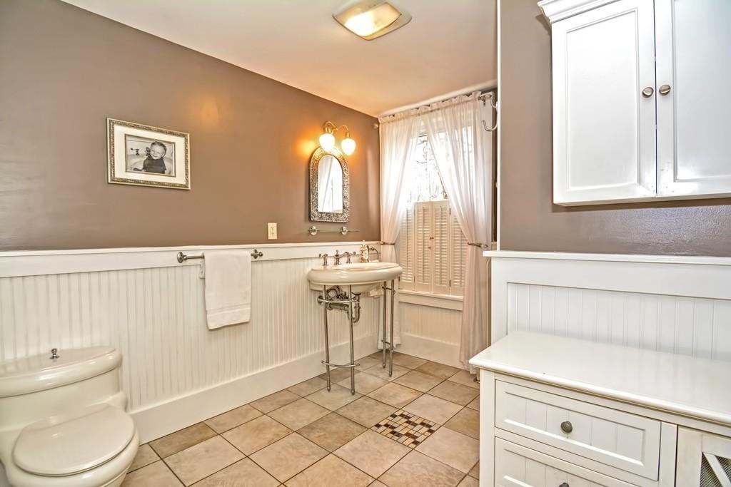 50 Warren Road Brimfield, MA 01010 - Photo 21 of 42 a bathroom with a sink a toilet and mirror