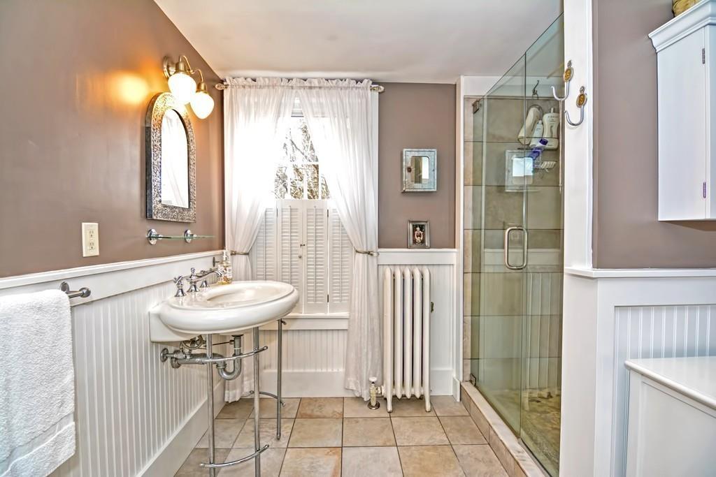 50 Warren Road Brimfield, MA 01010 - Photo 22 of 42 a bathroom with a sink a mirror and a shower