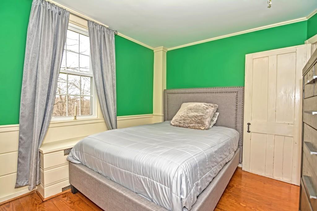 50 Warren Road Brimfield, MA 01010 - Photo 24 of 42 a bedroom with a bed and a large window