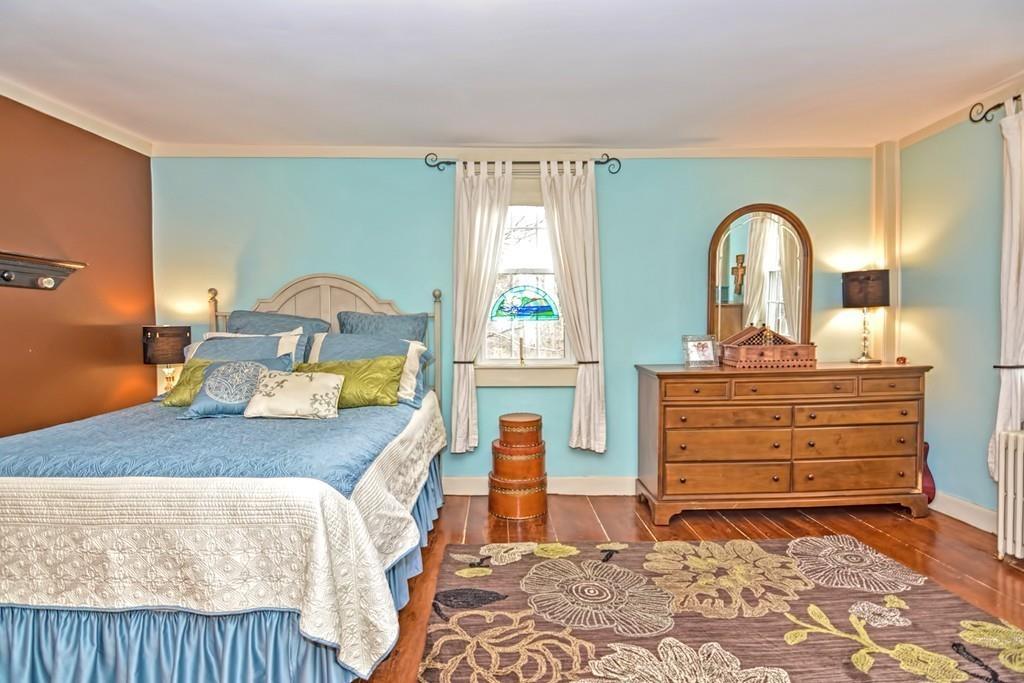 50 Warren Road Brimfield, MA 01010 - Photo 28 of 42 a bedroom with a bed and a dresser