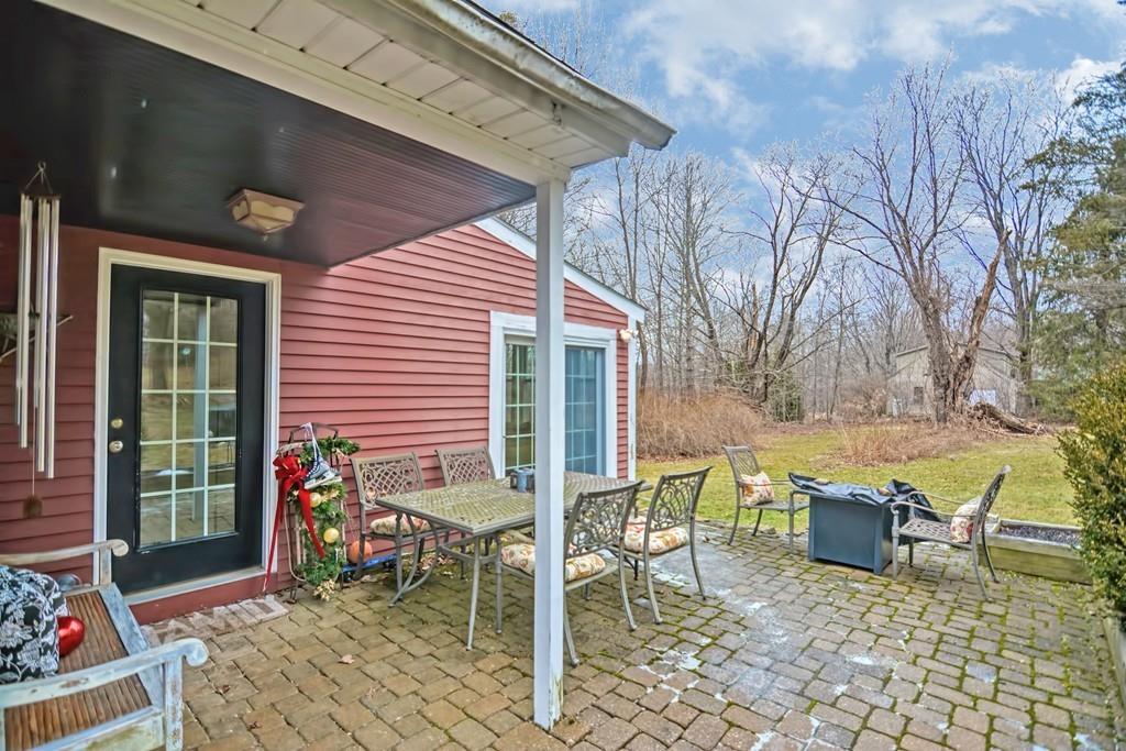 50 Warren Road Brimfield, MA 01010 - Photo 3 of 42 a view of a patio with a table and chairs and potted plants