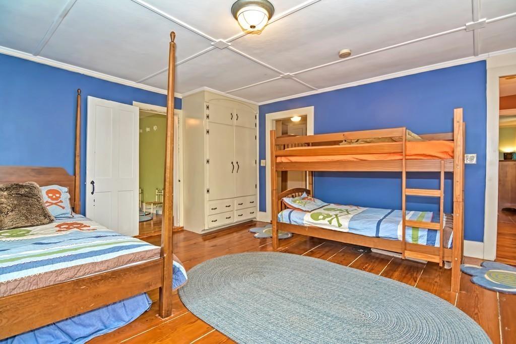 50 Warren Road Brimfield, MA 01010 - Photo 31 of 42 a bedroom with a bed and a table
