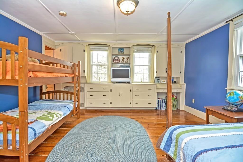 50 Warren Road Brimfield, MA 01010 - Photo 32 of 42 a bedroom with a bed and wooden floor