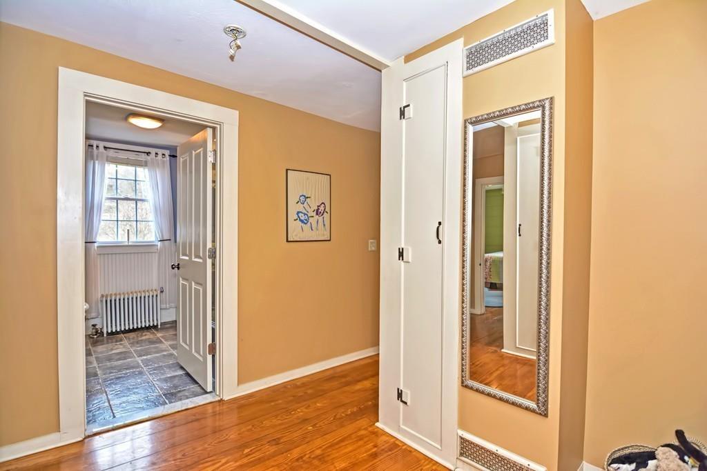 50 Warren Road Brimfield, MA 01010 - Photo 36 of 42 a view of a hallway with wooden floor and a bathroom